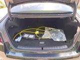 a trunk of a car with a bunch of electronics in it