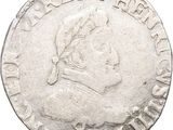 a close up of a coin on a white background