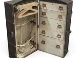 an old suitcase with a suit case inside of it