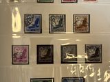 a picture of a picture of a collection of stamps on a wall