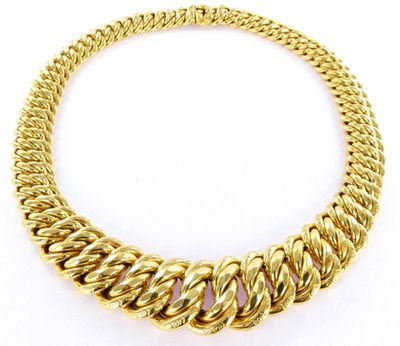 a yellow gold necklace with a twisted link