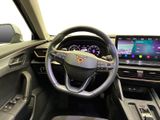 the interior of a car with a steering wheel, dashboard, and display screen