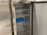 a refrigerator with a door open in a kitchen