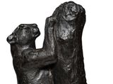 a statue of two bears that are touching each other