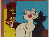 un vieux livre avec un chat assis par terre à côté d'une souris