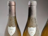 three bottles of wine sitting next to each other on a table