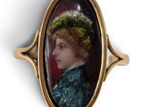 an oval portrait of a woman wearing a green hat and a blue dress