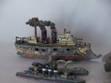 a toy boat that is sitting next to other toy boats