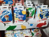 many boxes of cereal on the shelf in the store