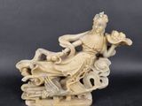 chinese carved ivory figurine of a woman sitting on a cloud