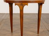 an image of a wooden table on a parquet floor