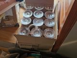 a box of watermelons sitting on the floor next to a box of watermelons