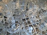 a lot of empty glasses on a tray on the table
