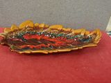 a close up of a plate on a table with a red cloth