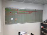 an image of an office with a large calendar on the wall