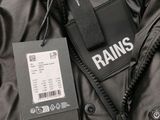 a close up of a rain jacket with a tag attached to it