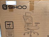 a cardboard box with a picture of a computer chair in it