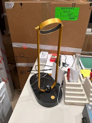 a lamp that is sitting on a table in a room