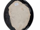 a black plate with a white label on it