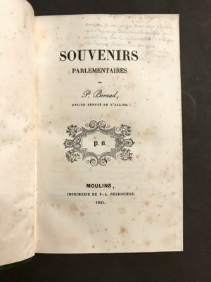 an open book on a table with a black background