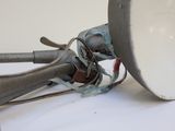 a close up of a trumpet on a white surface