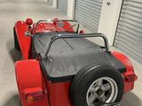 an image of a red sports car parked in a garage