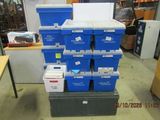many boxes stacked on top of each other in a room