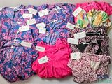 a lot of clothes that are sitting on a table