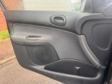 the door of a car with a speaker in the middle of it