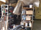 a pile of junk sitting in a garage next to a bike