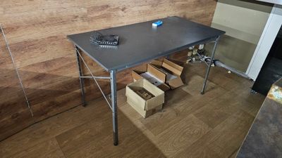 a table that has a bunch of boxes on it