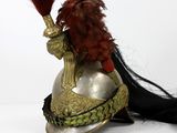 a helmet with a feather on top of it