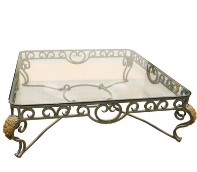 a glass table with a metal frame and a glass top