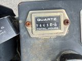 a close up of a motor bike with a number plate on it