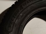 a tire that is sitting on the floor next to a wall