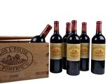 six bottles of red wine in a wooden crate on a white background