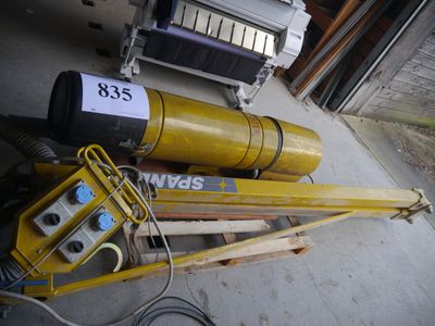 a pile of equipment that is sitting outside of a garage