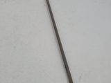 an old tool is laying on a white surface