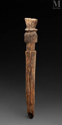 a close up of a wooden object on a black background