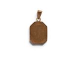 a close up of a wooden pendant on a white background