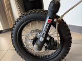 a dirt bike that is parked in the kitchen