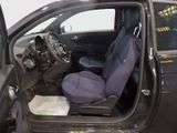 a small car with a blue seat in the back