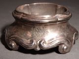 a silver bowl that is sitting on a table