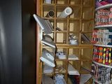 a refrigerator in the corner of a room with a lot of items on the shelves