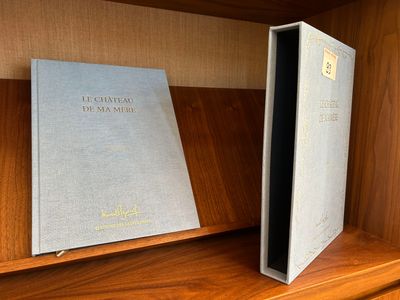 a book sitting on a book shelf next to a book case