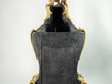 an antique black and gold clock with a lion on top of it