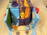 a toy that is sitting on a table in front of a box