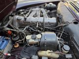 a close up of a car ' s engine with its hood open