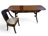 an image of a wooden desk with a chair next to it