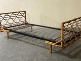a bed that has a metal frame on it